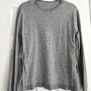 Gray sweater with striped tie detail